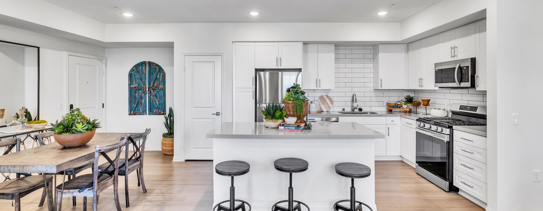 a kitchen with a table and chairs