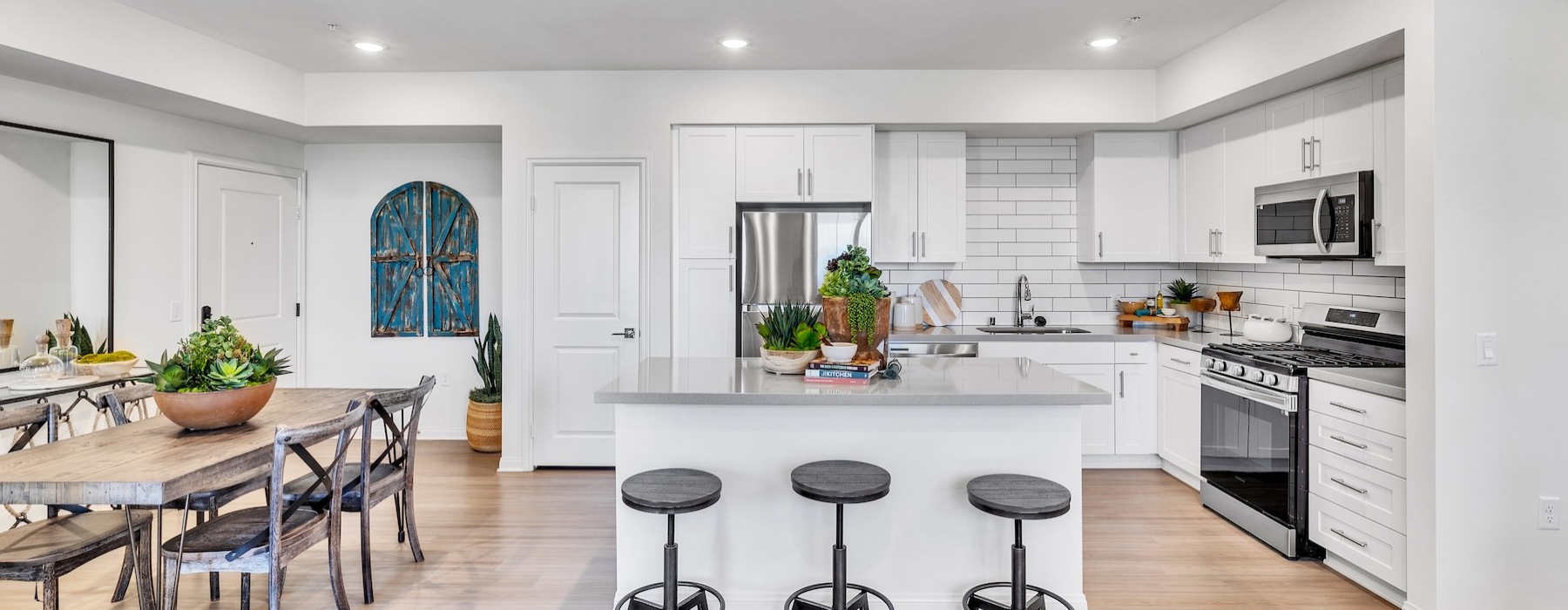 a kitchen with a table and chairs