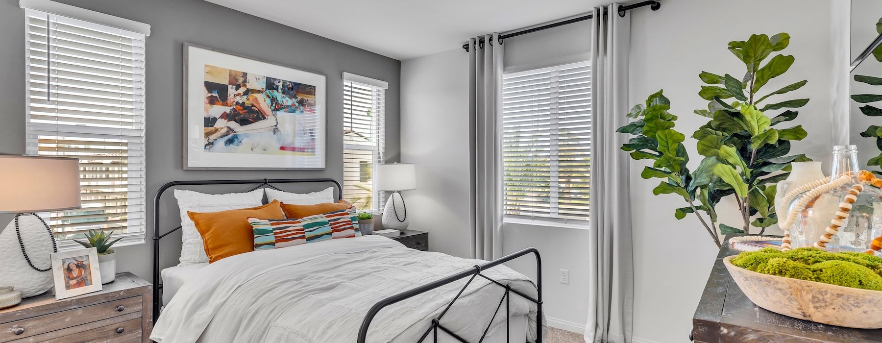 a bedroom with a bed and two nightstands