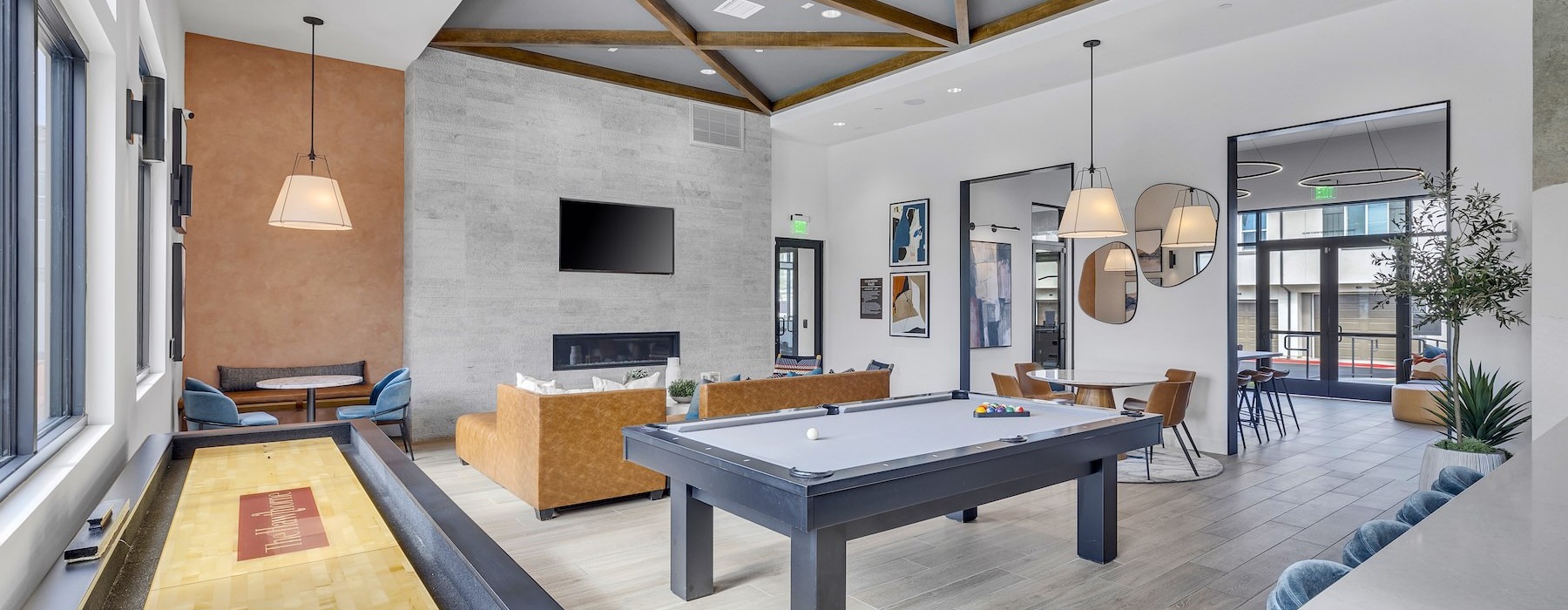 a clubroom with a pool table and a tv