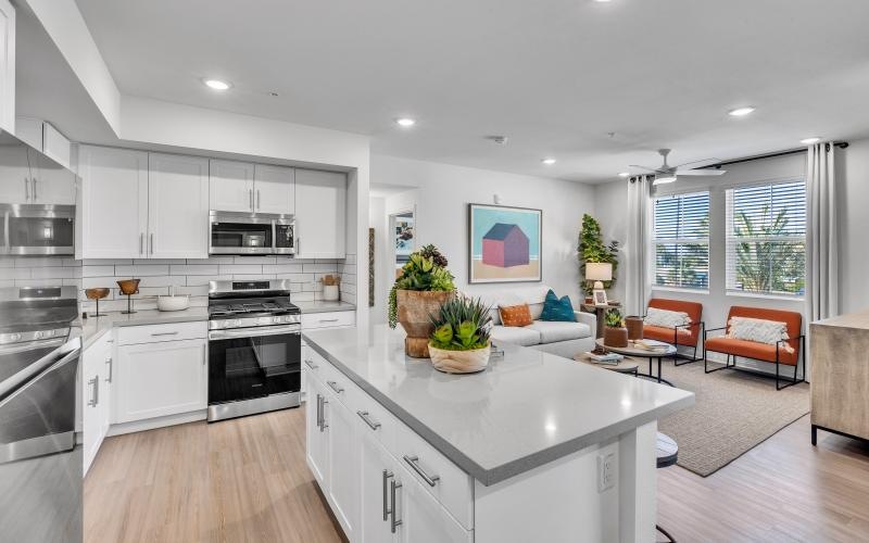 a kitchen with white cabinets